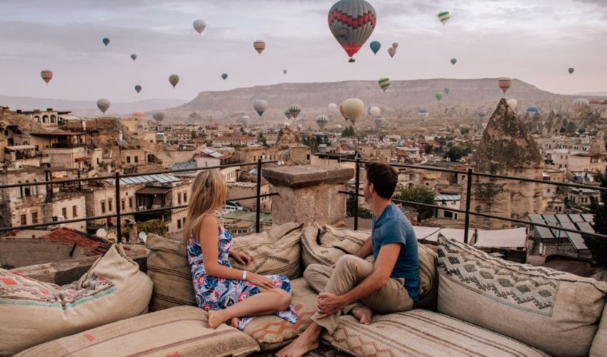 Watching Balloons From A Rooftop